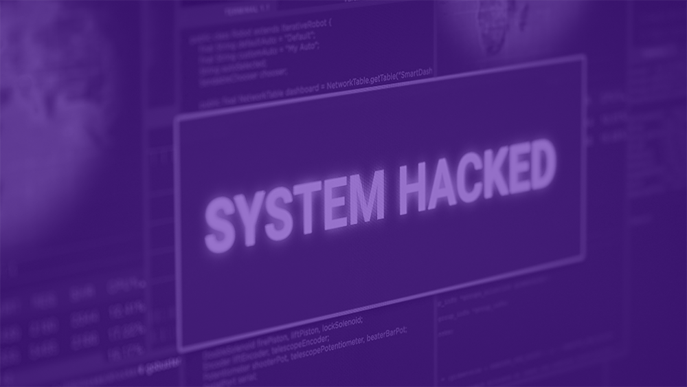 Pasos-a-seguir-tras-ciberataque monitor mostrando alerta de sistema hackeado